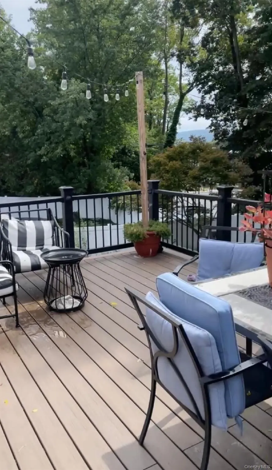 Wooden deck featuring an outdoor hangout area Wooden deck featuring an outdoor hangout area