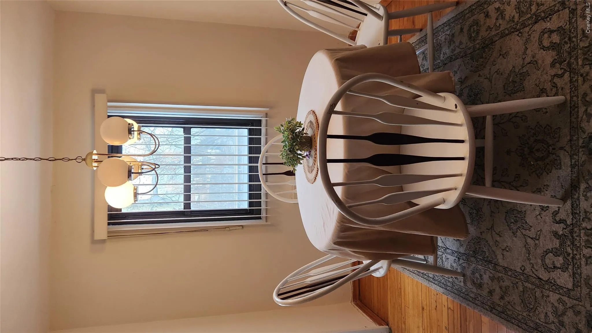 Dining space featuring light wood-style flooring and a chandelier Dining space featuring light wood-style flooring and a chandelier