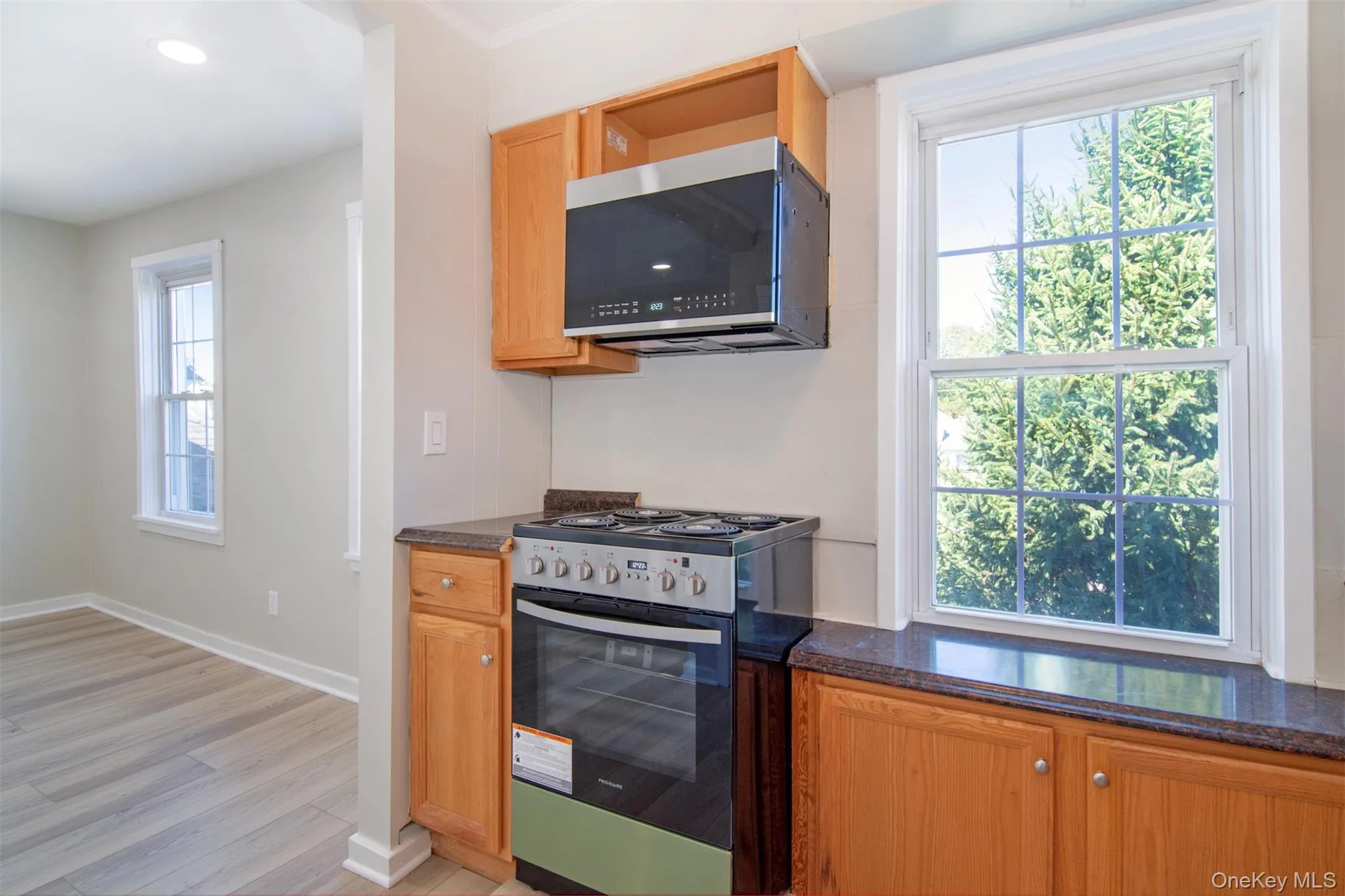 Another view of the kitchen with partial view of the living room. Another view of the kitchen with partial view of the living room.