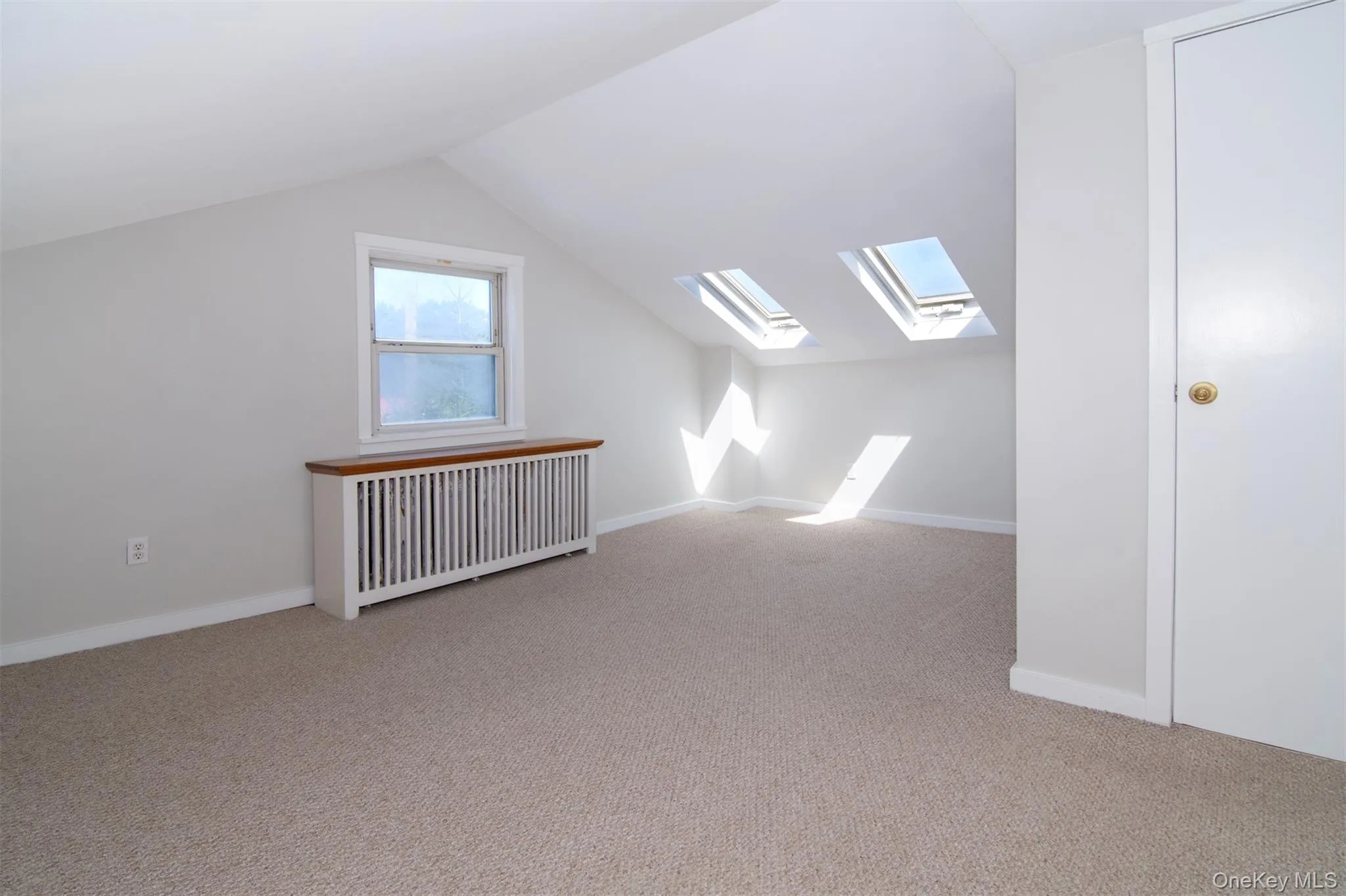 Second upstairs bedroom features skylights, closets/storage space. Second upstairs bedroom features skylights, closets/storage space.