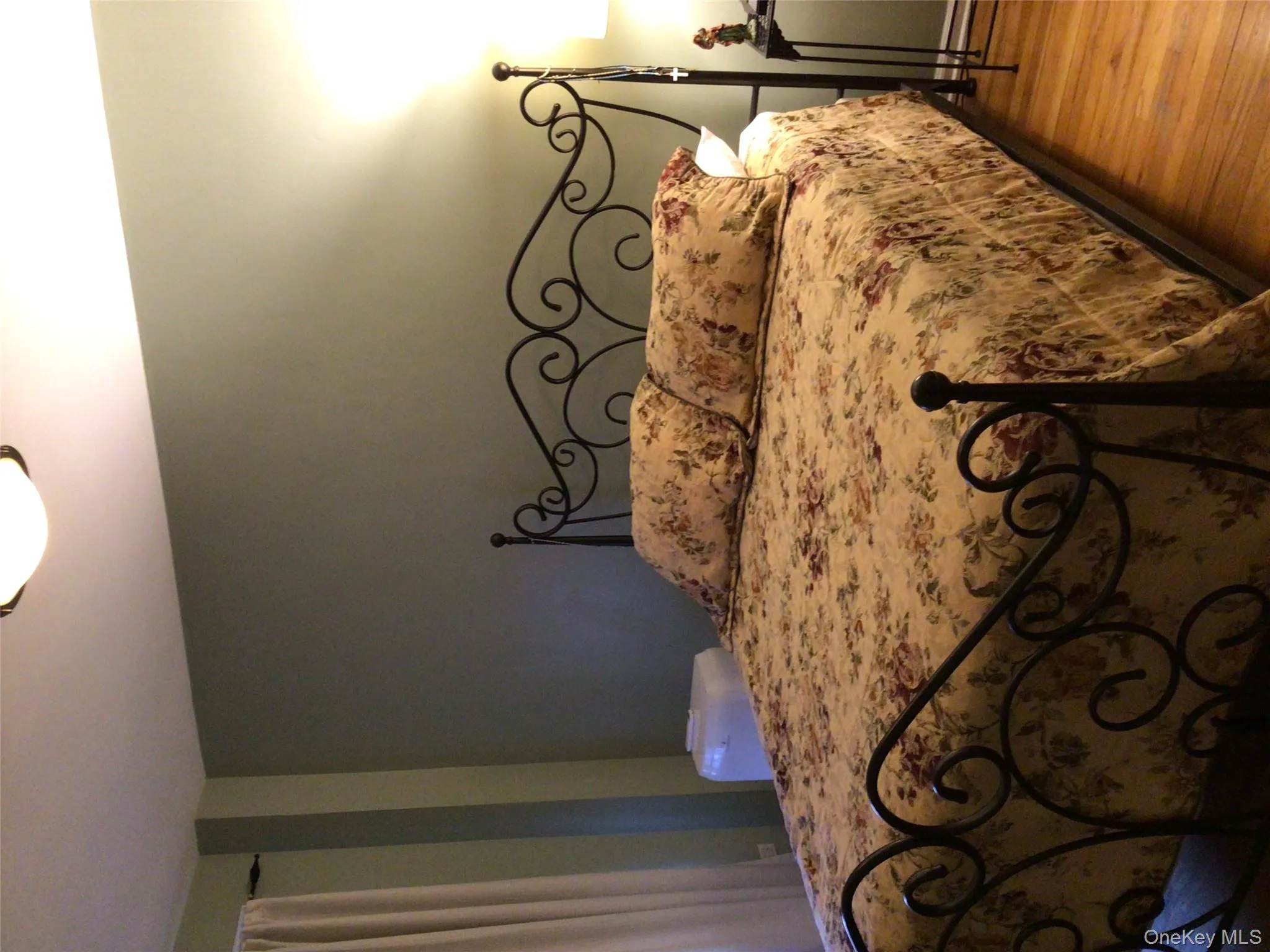 Bedroom featuring wood finished floors Bedroom featuring wood finished floors