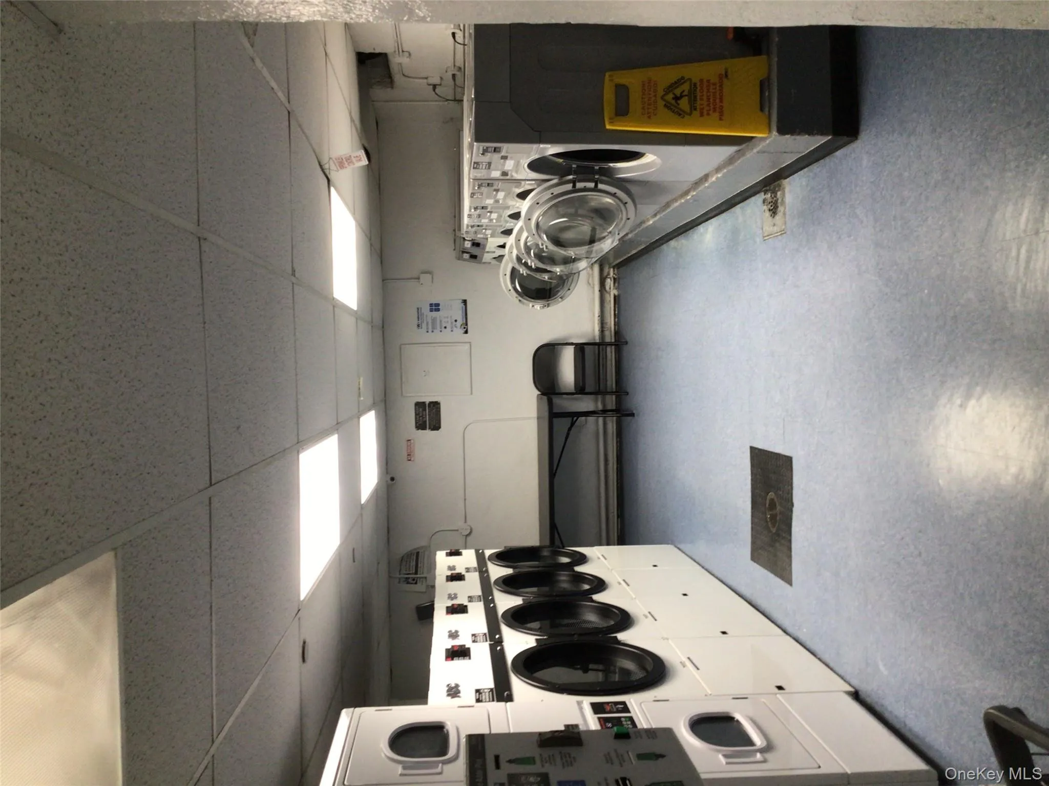 Washroom featuring a drop ceiling and washer and clothes dryer Washroom featuring a drop ceiling and washer and clothes dryer