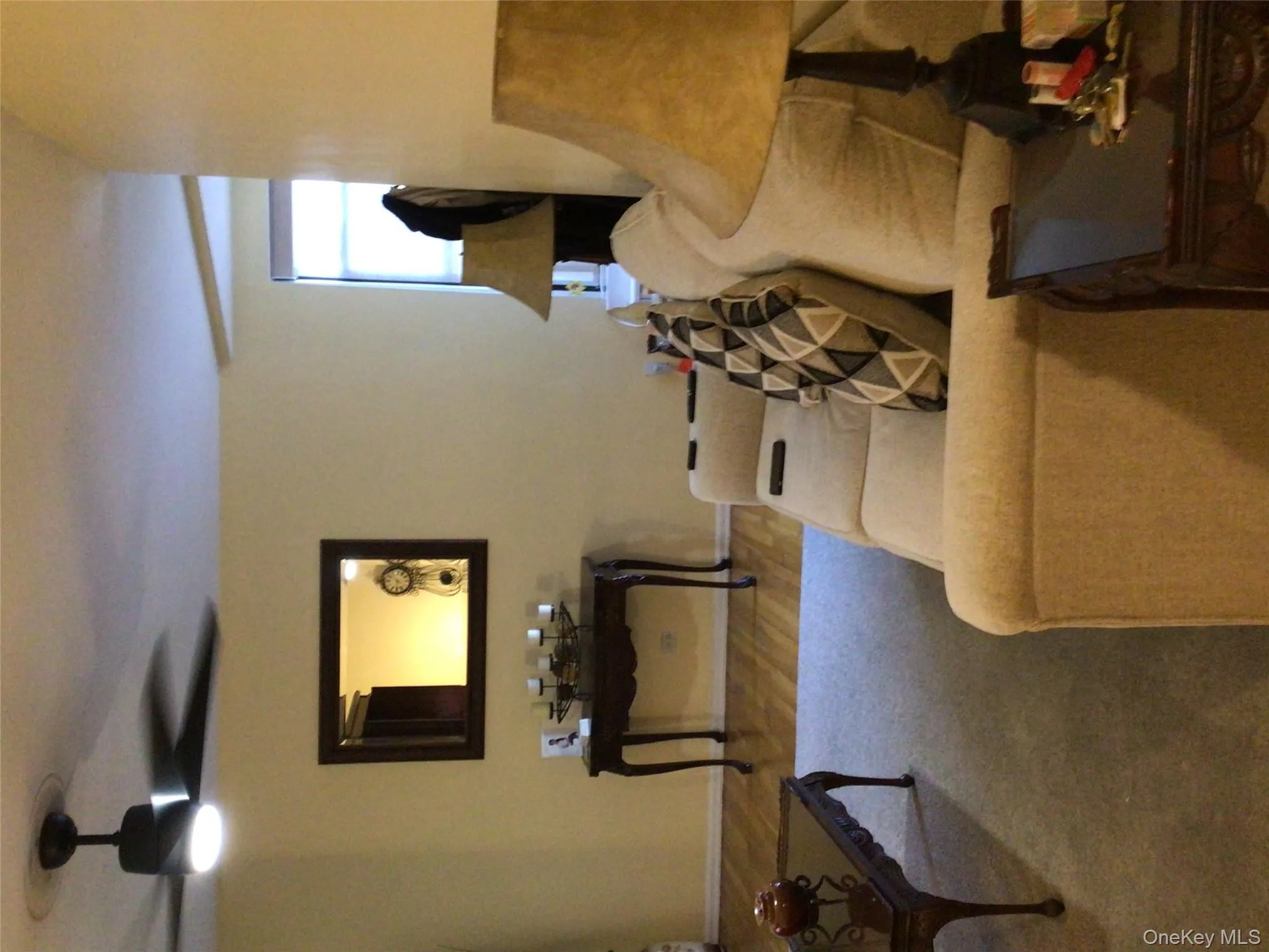 Living room featuring wood finished floors and ceiling fan Living room featuring wood finished floors and ceiling fan