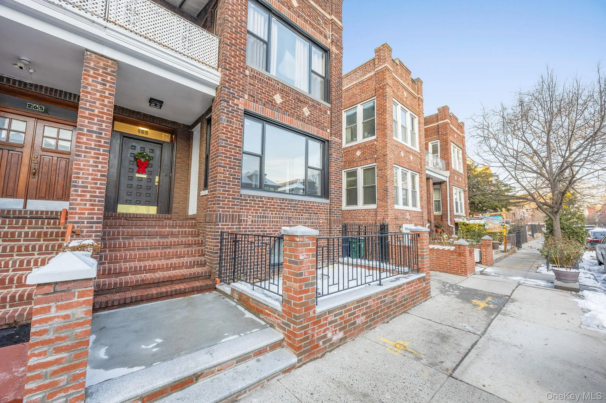 Entrance to property with brick siding and a residential view Entrance to property with brick siding and a residential view