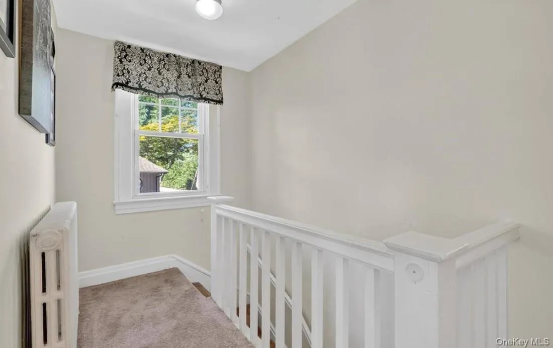 Second floor landing with radiator and carpet Second floor landing with radiator and carpet