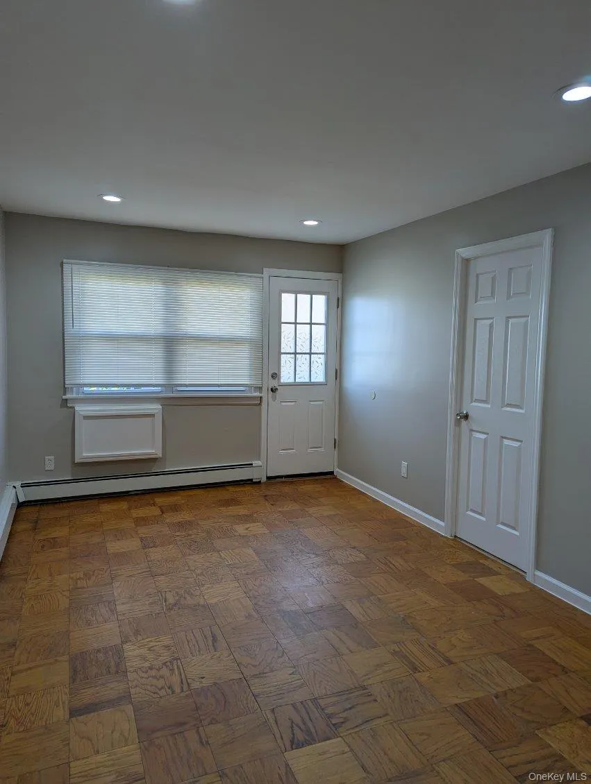 Doorway with recessed lighting and a baseboard heating unit Doorway with recessed lighting and a baseboard heating unit
