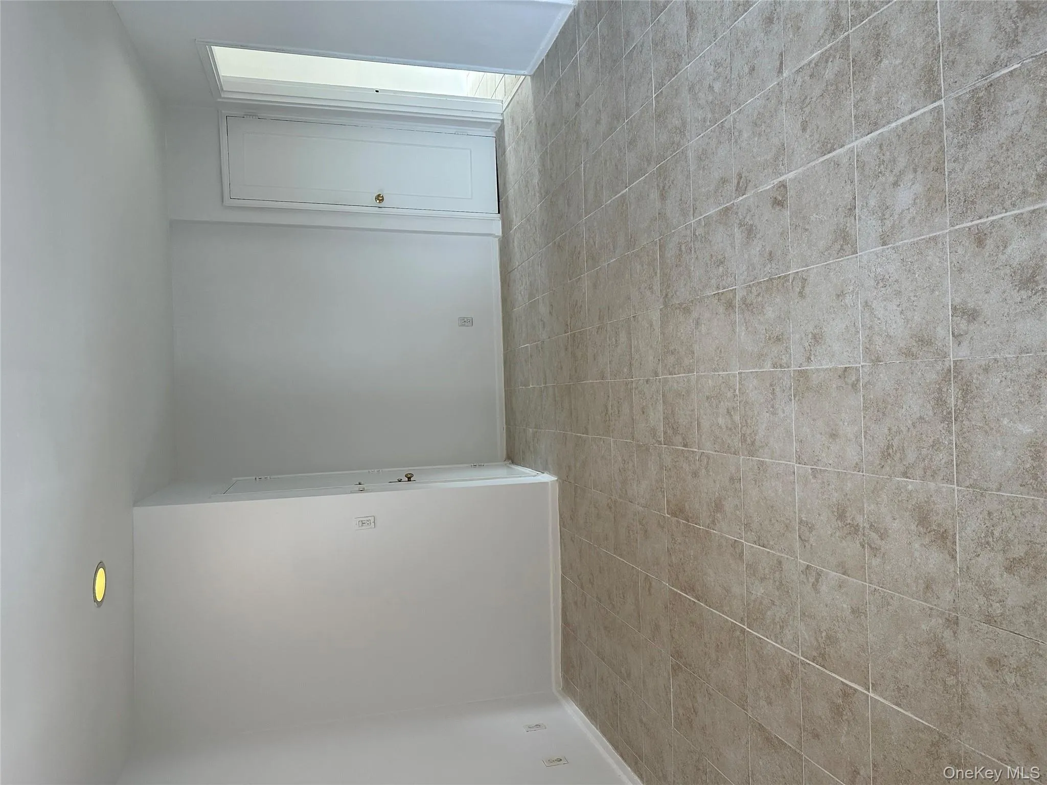 Spare room featuring light tile patterned floors and recessed lighting Spare room featuring light tile patterned floors and recessed lighting