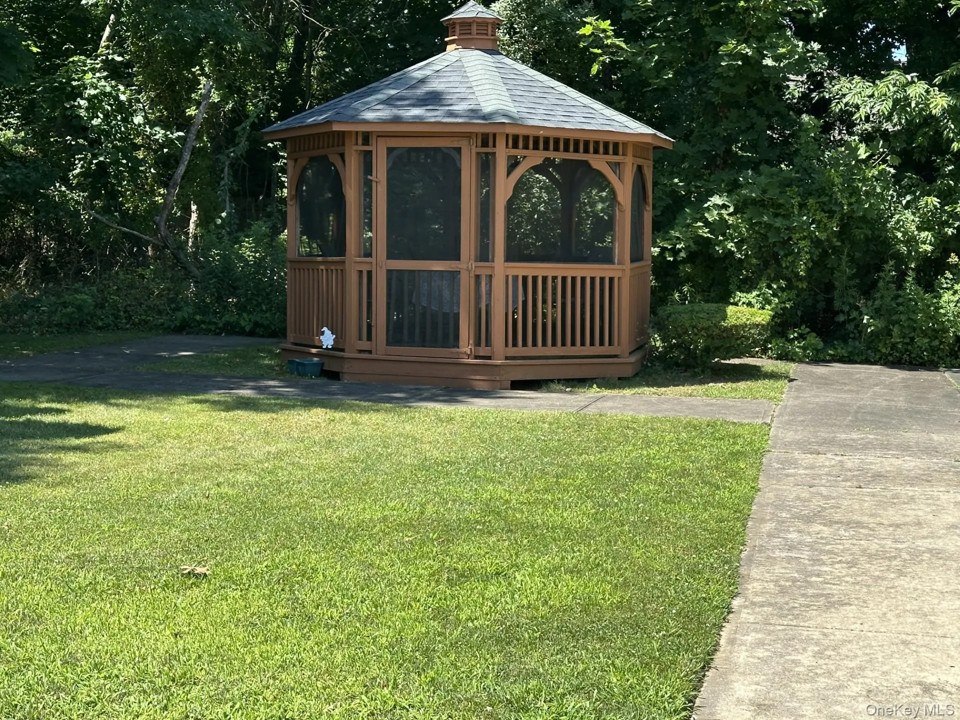 View of outbuilding with a gazebo and view of wooded area View of outbuilding with a gazebo and view of wooded area