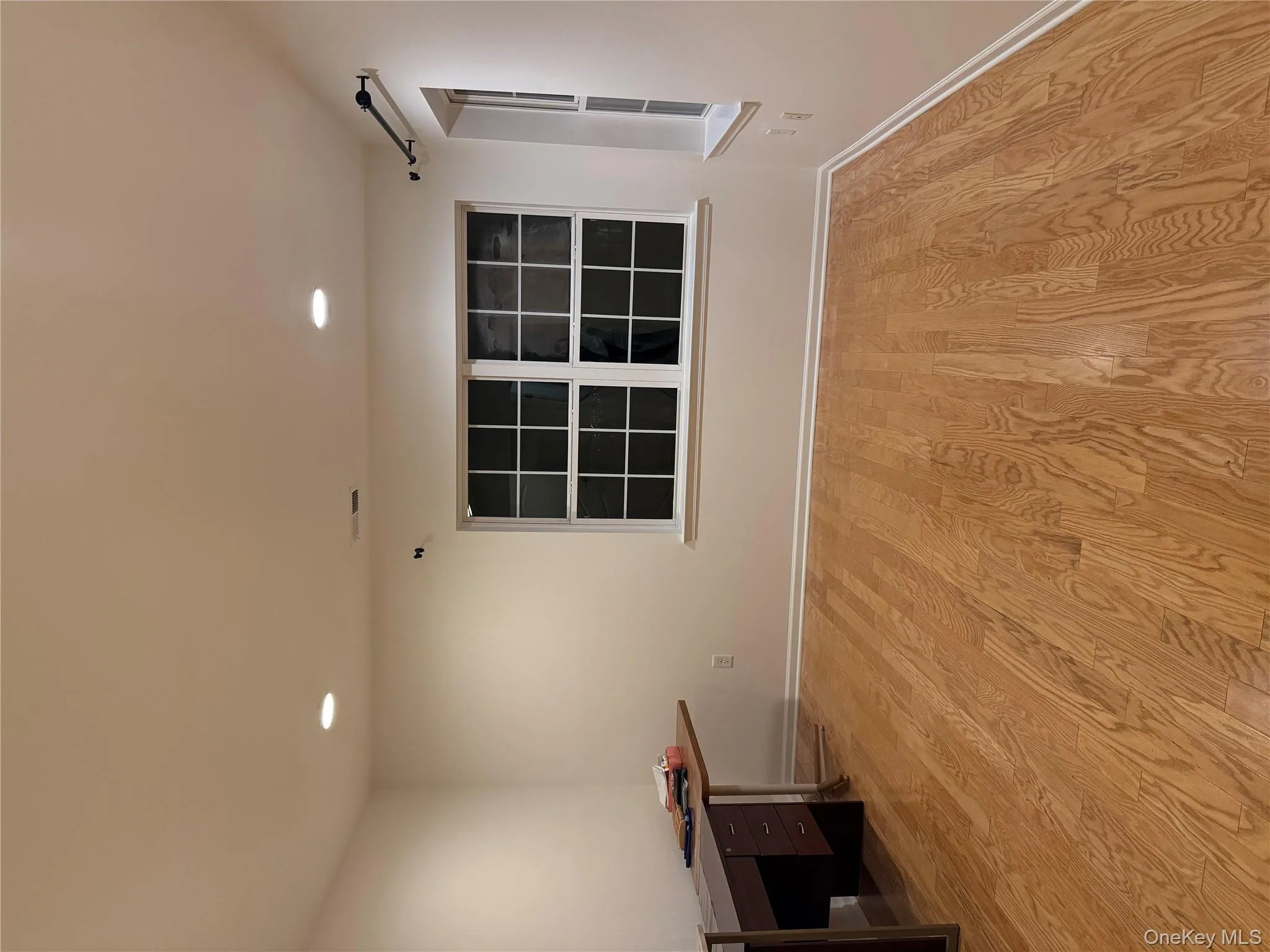 Unfurnished room featuring light wood-style flooring, recessed lighting, and a desk Unfurnished room featuring light wood-style flooring, recessed lighting, and a desk