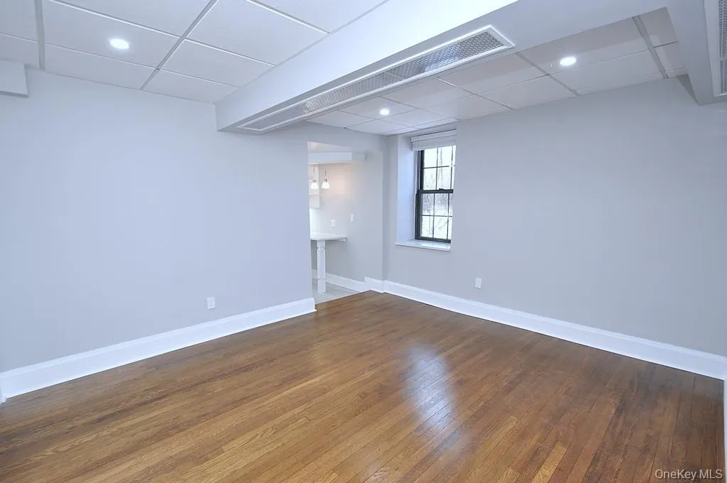 Fully renovated Living space has refinished hardwood floors, fresh paint and overhead lighting. The room is approx 13'-6" x 13". Fully renovated Living space has refinished hardwood floors, fresh paint and overhead lighting. The room is approx 13'-6" x 13".