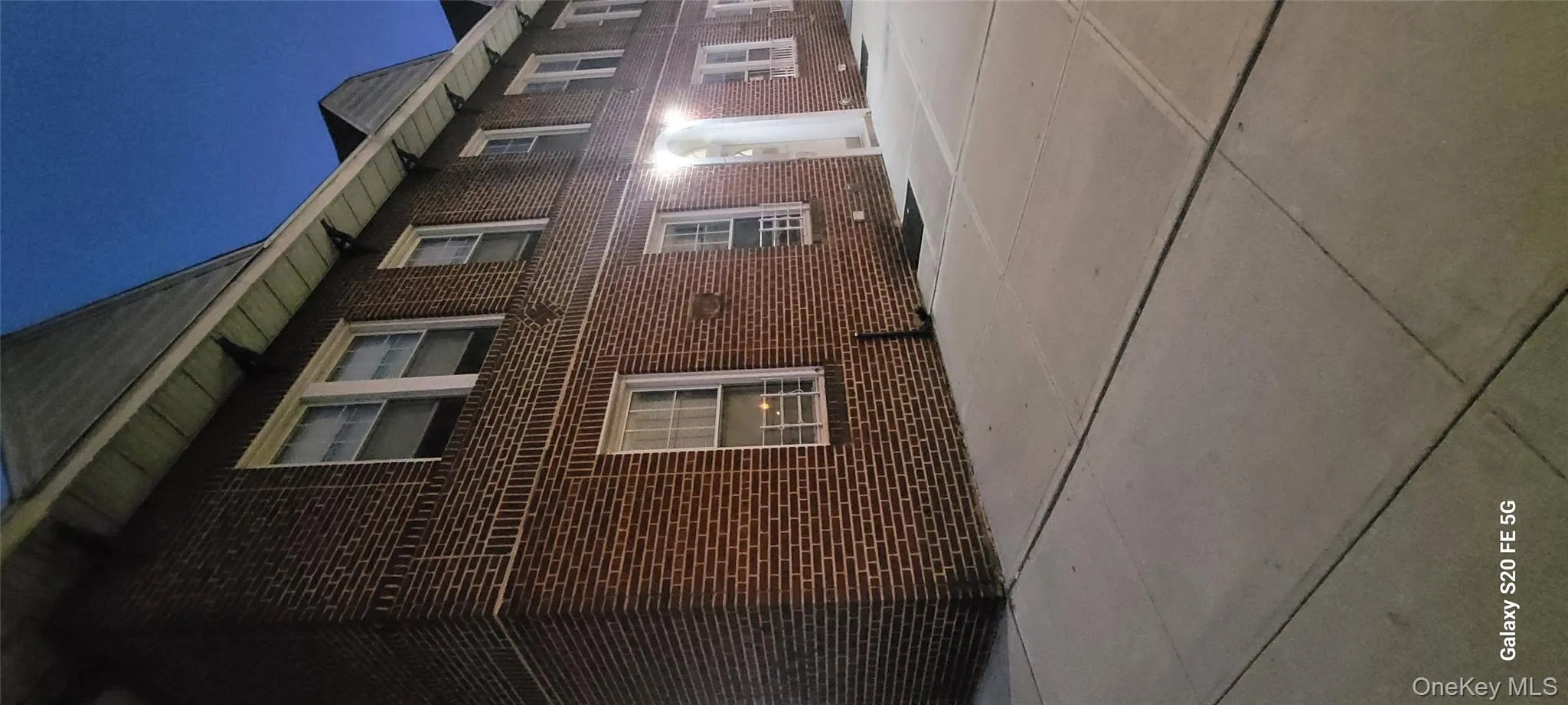 View of side of home with brick siding View of side of home with brick siding