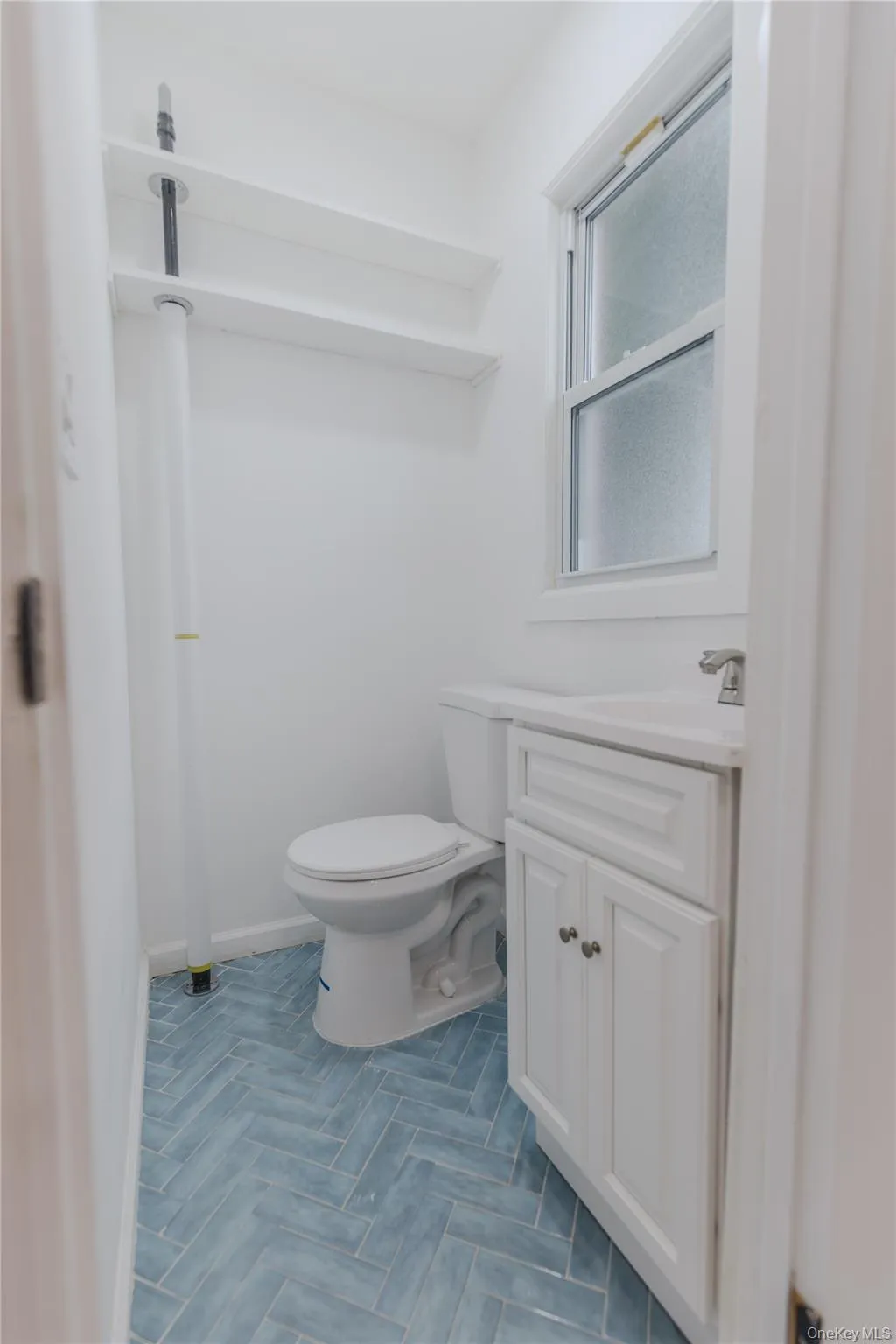 Bathroom featuring vanity and toilet Bathroom featuring vanity and toilet