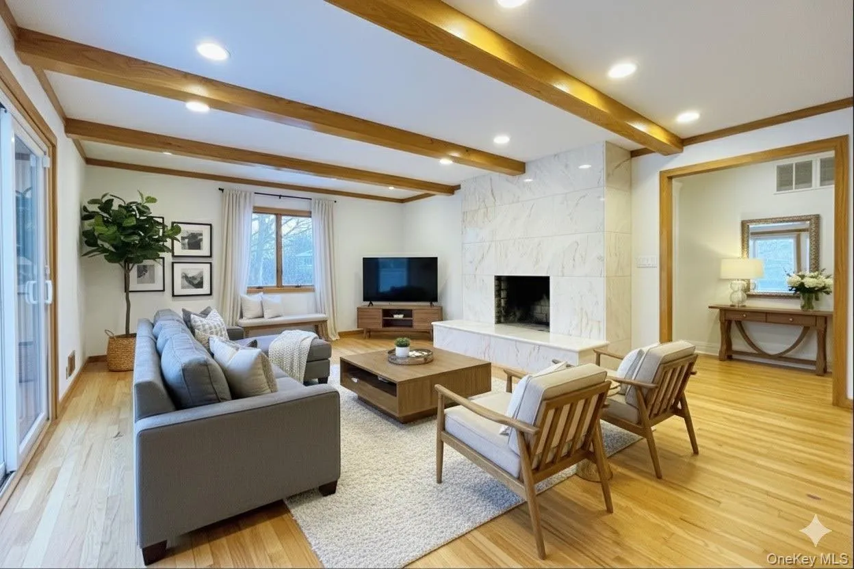 Family Room virtually state with a fireplace, beamed ceiling, light wood-style flooring, and recessed lighting Family Room virtually state with a fireplace, beamed ceiling, light wood-style flooring, and recessed lighting