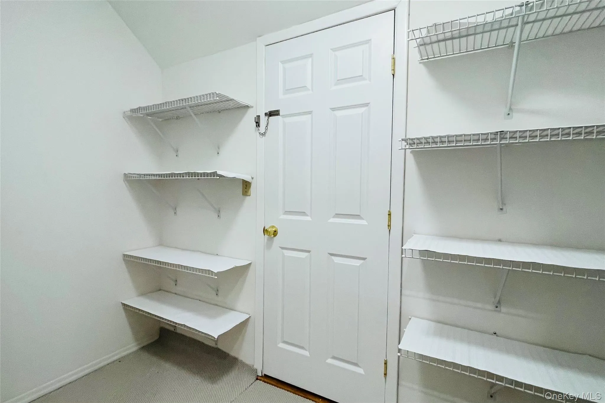 Additional storage, large closet with shelving on second floor, door to attic Additional storage, large closet with shelving on second floor, door to attic