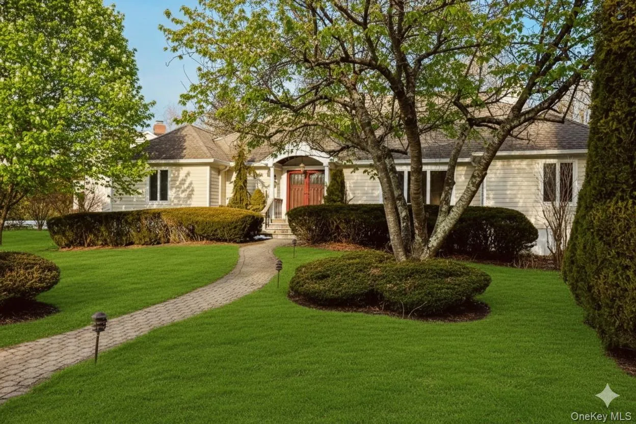 Summer view of home featuring a front yard virtual greenery Summer view of home featuring a front yard virtual greenery