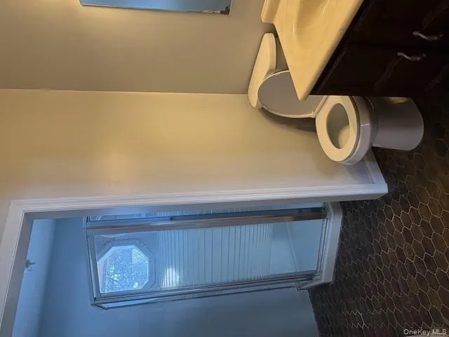 Bathroom with a shower stall and vanity Bathroom with a shower stall and vanity