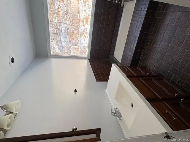 Bathroom with a bath and vanity Bathroom with a bath and vanity