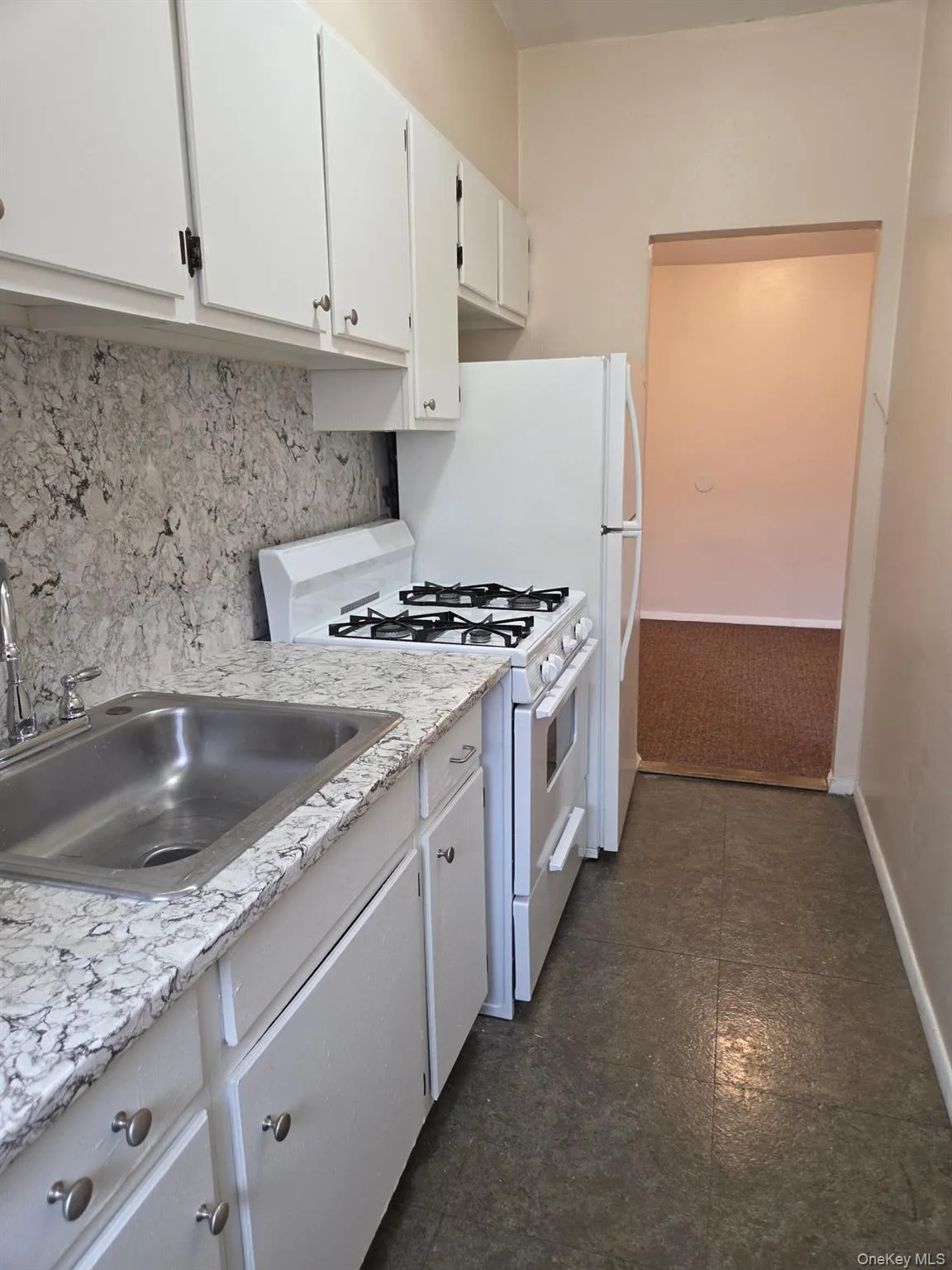 GALLEY KITCHEN WITH NEW COUNTERTOP AND FRESHLY PAINTED CABINETS GALLEY KITCHEN WITH NEW COUNTERTOP AND FRESHLY PAINTED CABINETS