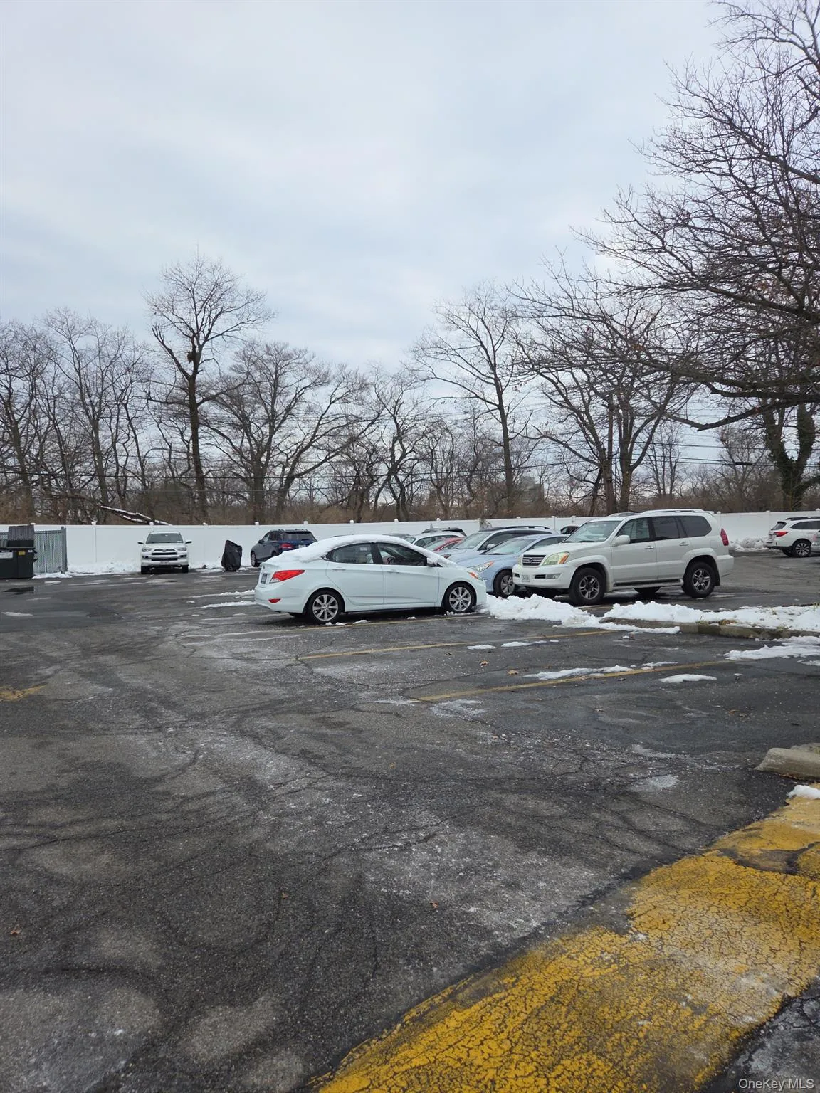 View of uncovered parking lot View of uncovered parking lot