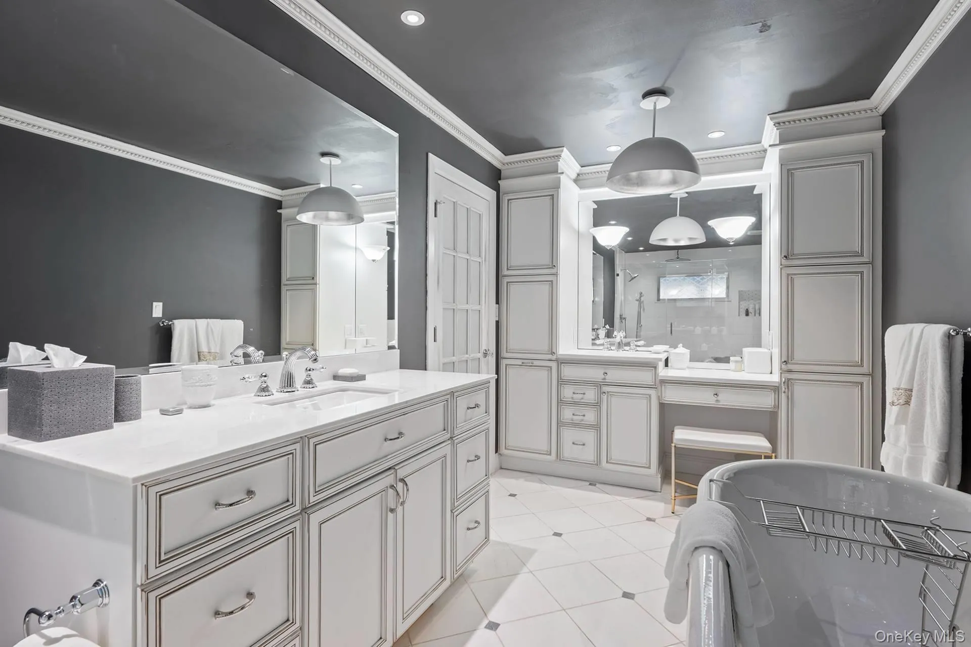 Bathroom featuring vanity, a stall shower, ornamental molding, recessed lighting, and light tile patterned flooring