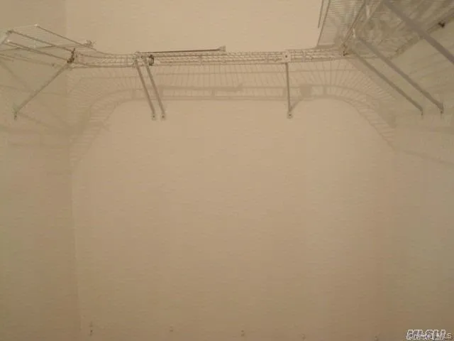 View of walk in closet View of walk in closet