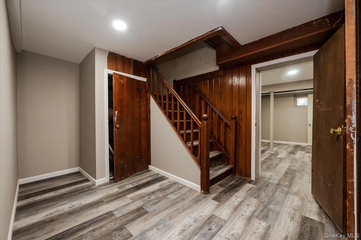 Below grade area with stairway and light wood-type flooring Below grade area with stairway and light wood-type flooring