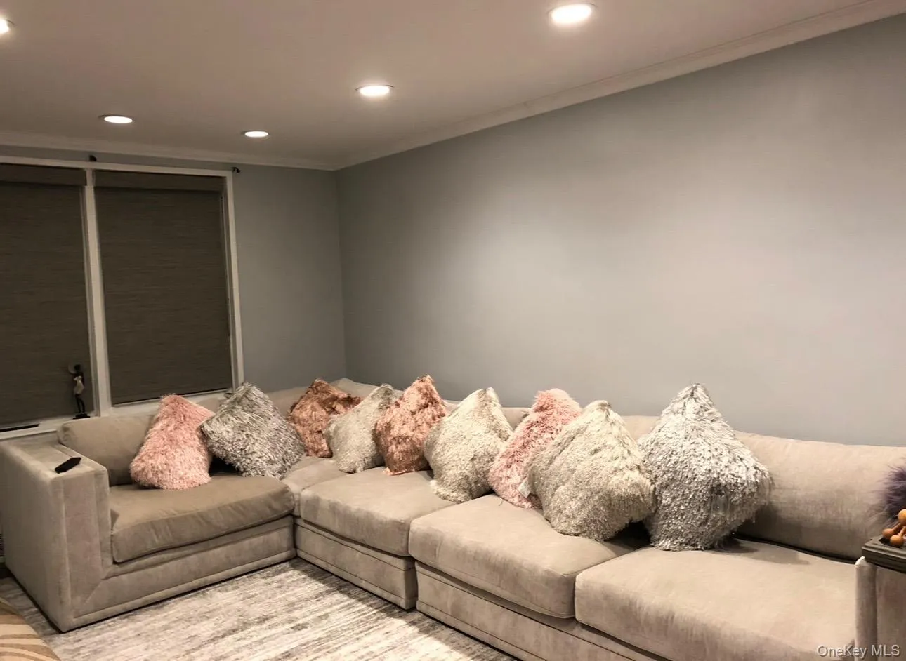 Living area with recessed lighting and crown molding Living area with recessed lighting and crown molding