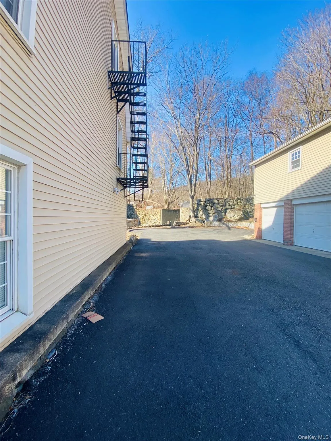 View of side of property with a garage View of side of property with a garage