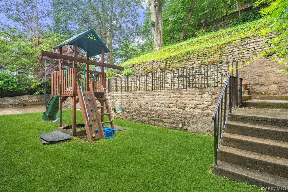 View of playground with a lawn View of playground with a lawn