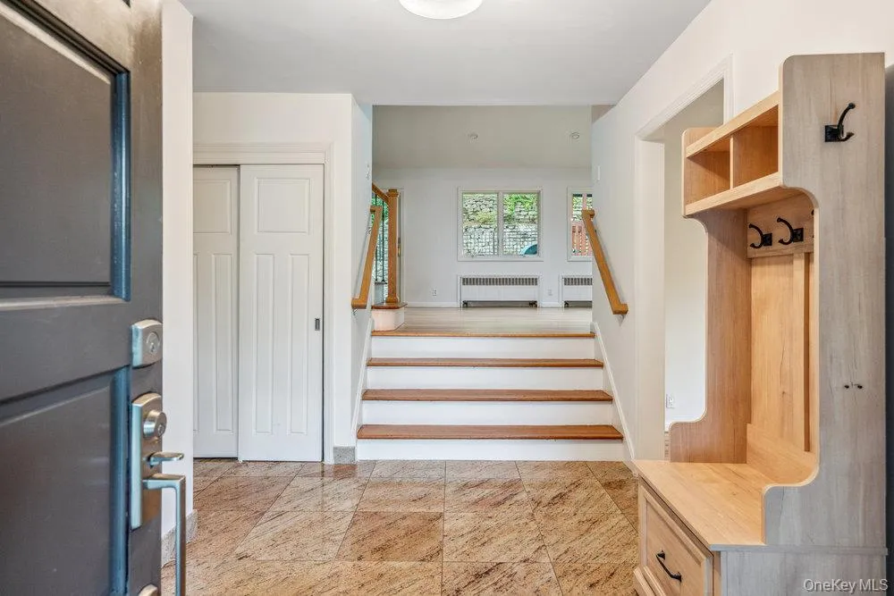 Stairway featuring radiator heating unit Stairway featuring radiator heating unit