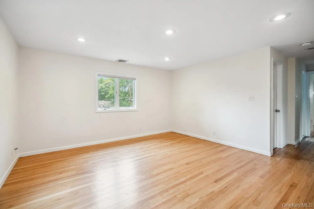Unfurnished room featuring light wood-type flooring and recessed lighting Unfurnished room featuring light wood-type flooring and recessed lighting