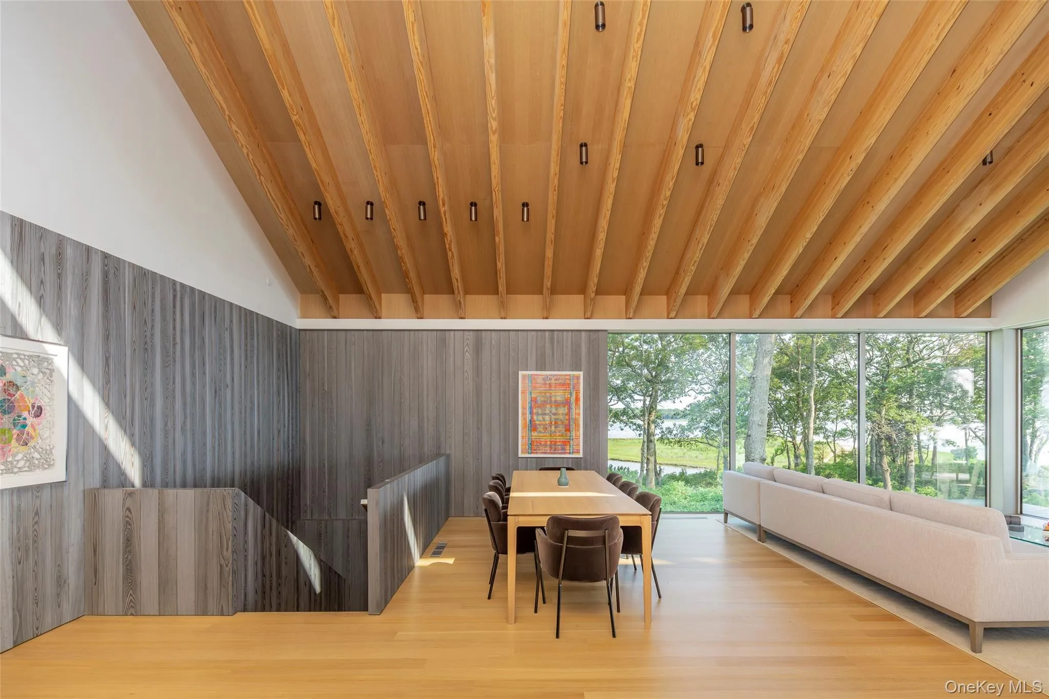 Dining area featuring vaulted ceiling, wooden ceiling, and wood finished floors Dining area featuring vaulted ceiling, wooden ceiling, and wood finished floors