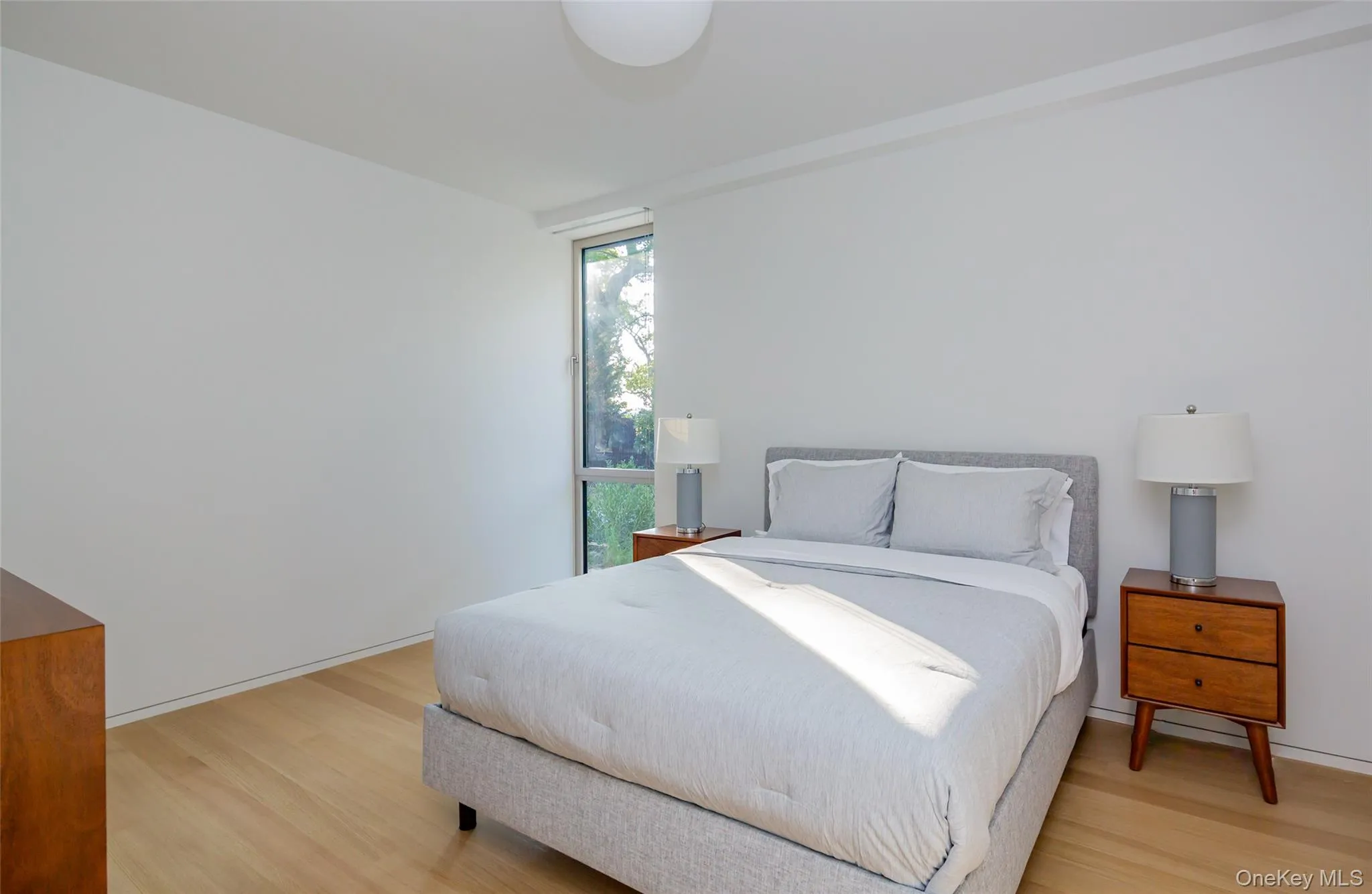 Bedroom featuring light wood finished floors Bedroom featuring light wood finished floors
