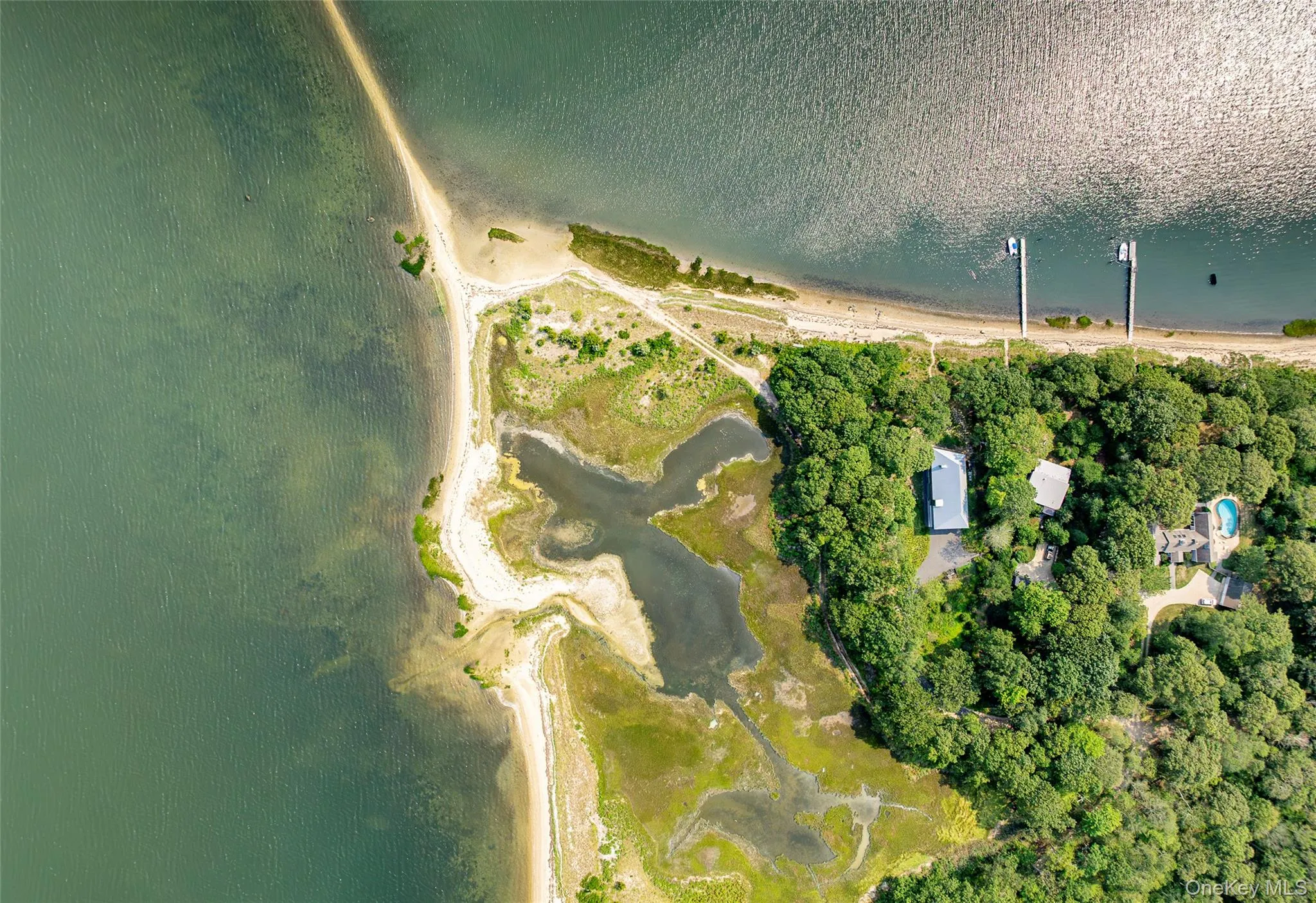 Aerial view of property and surrounding area featuring a nearby body of water Aerial view of property and surrounding area featuring a nearby body of water
