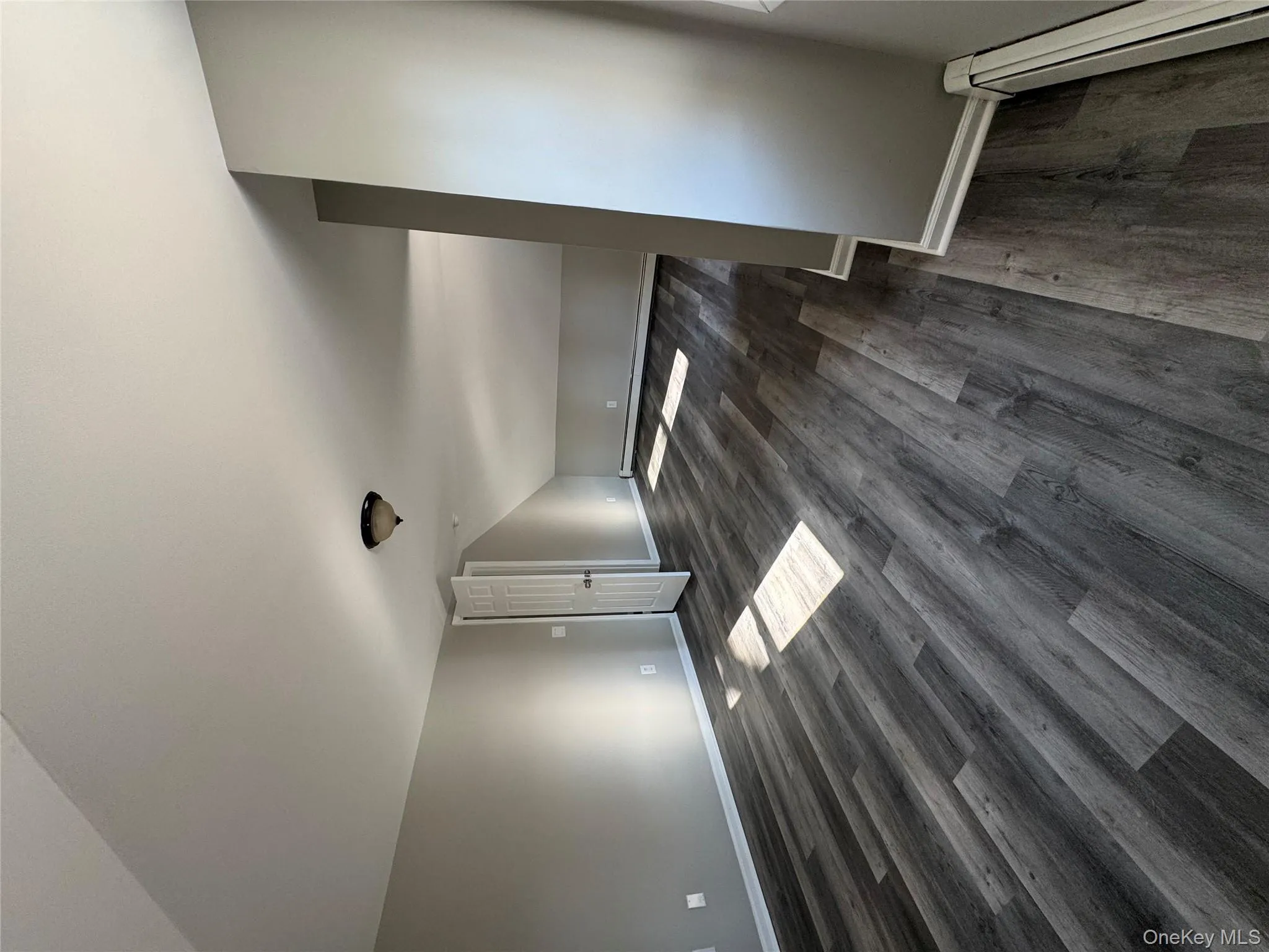 Bonus room with lofted ceiling, baseboard heating, and dark wood-type flooring Bonus room with lofted ceiling, baseboard heating, and dark wood-type flooring