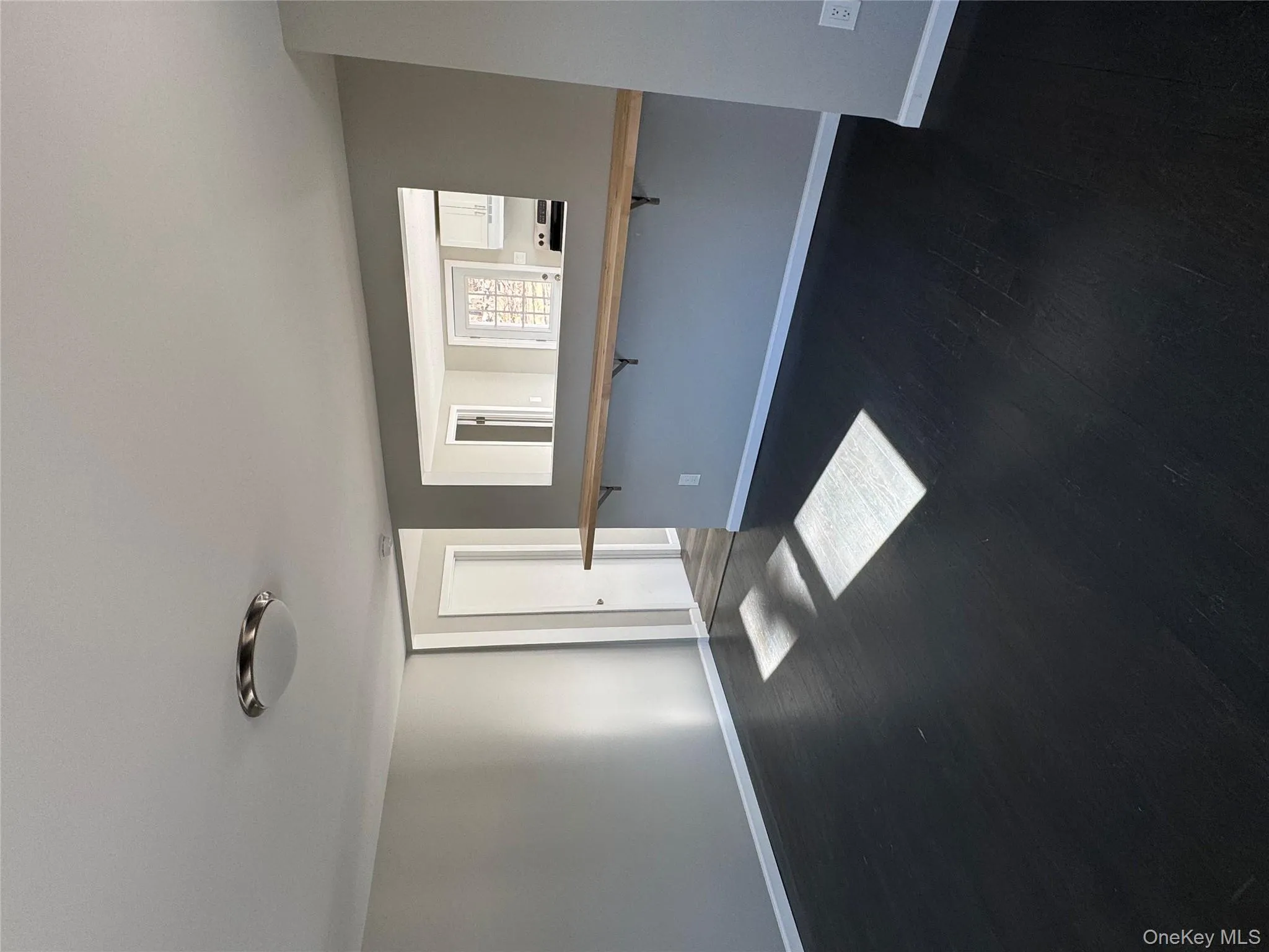 Spare room with dark hardwood / wood-style flooring Spare room with dark hardwood / wood-style flooring