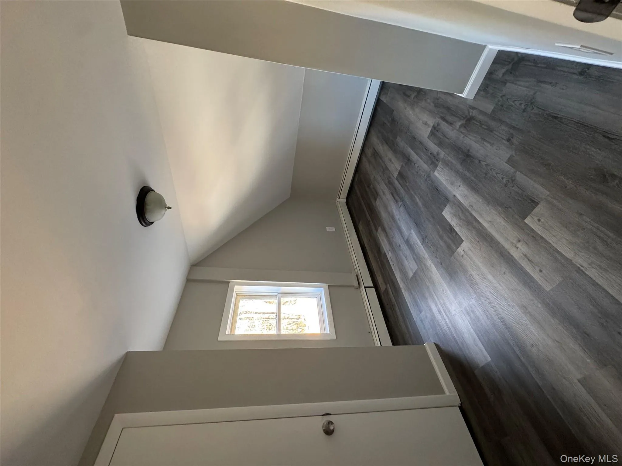 Additional living space featuring dark hardwood / wood-style floors and vaulted ceiling Additional living space featuring dark hardwood / wood-style floors and vaulted ceiling