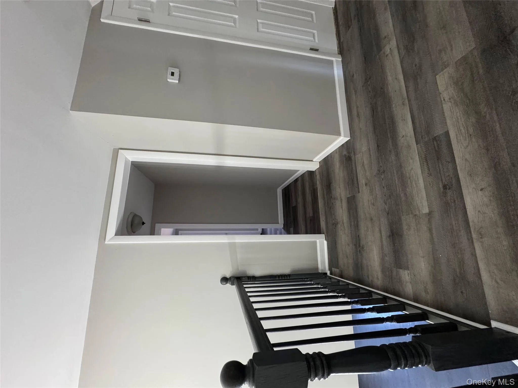 Hall featuring dark wood-type flooring Hall featuring dark wood-type flooring