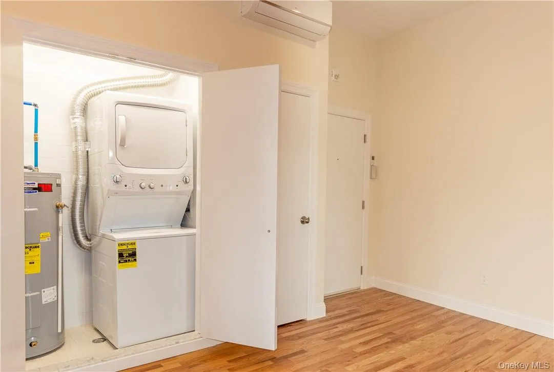Each unit has its own GE stack-able washer/dryer & hot water heater. To the right is the hall closet, intercom system & thermostat for the split system heat/AC unit. Each unit has its own GE stack-able washer/dryer & hot water heater. To the right is the hall closet, intercom system & thermostat for the split system heat/AC unit.