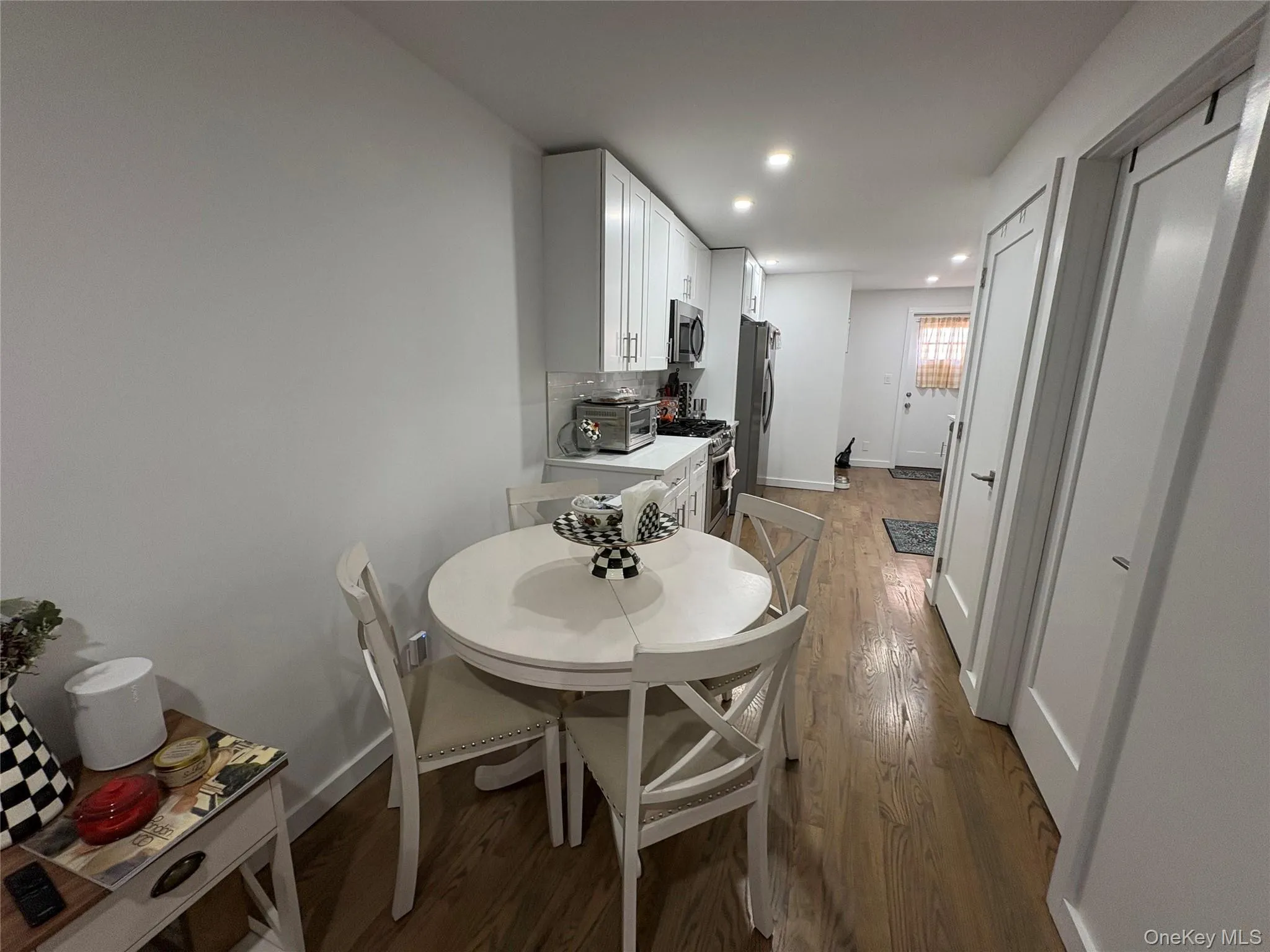 Dining space featuring dark wood finished floors and recessed lighting Dining space featuring dark wood finished floors and recessed lighting