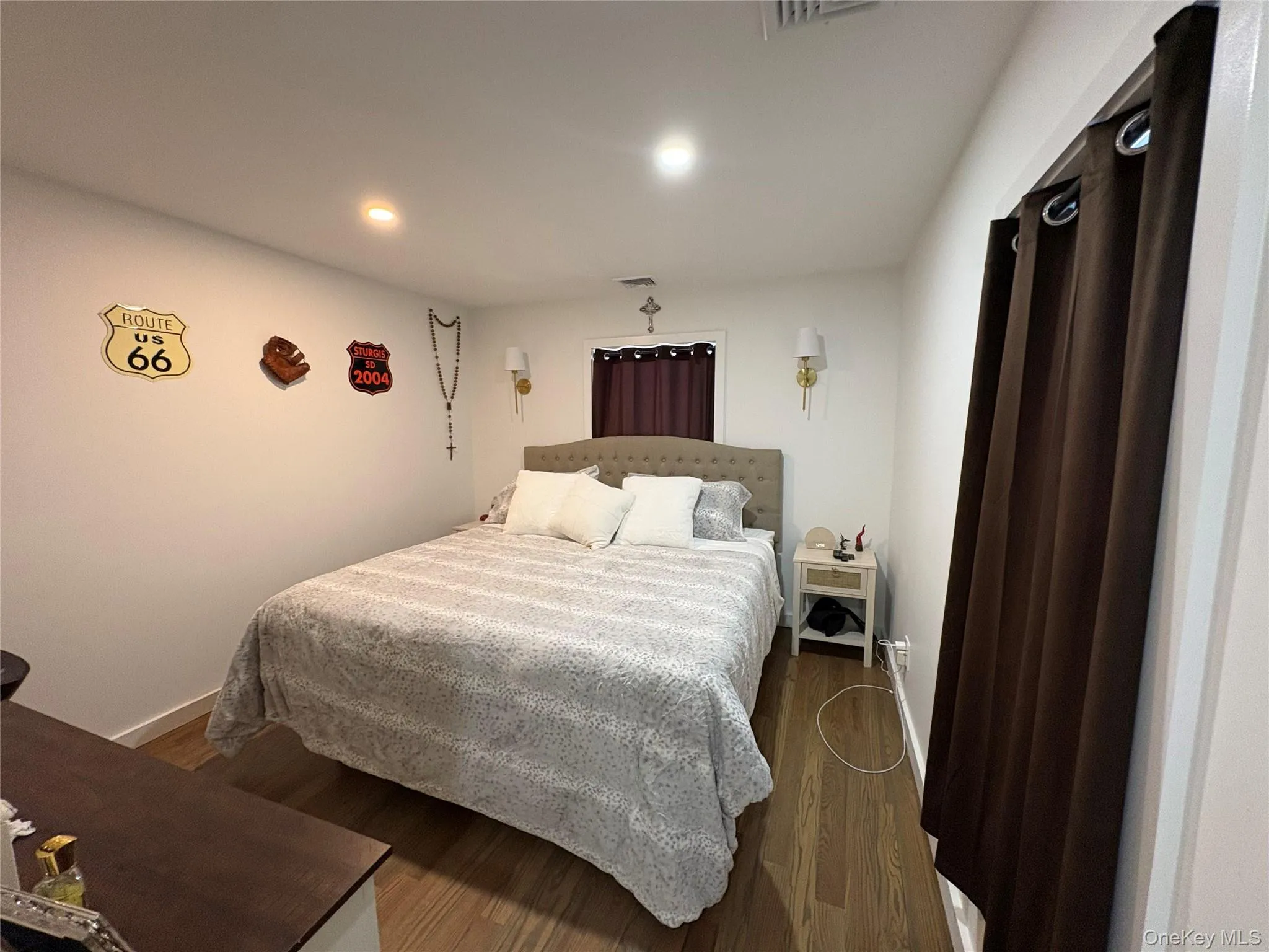 Bedroom with wood finished floors and recessed lighting Bedroom with wood finished floors and recessed lighting