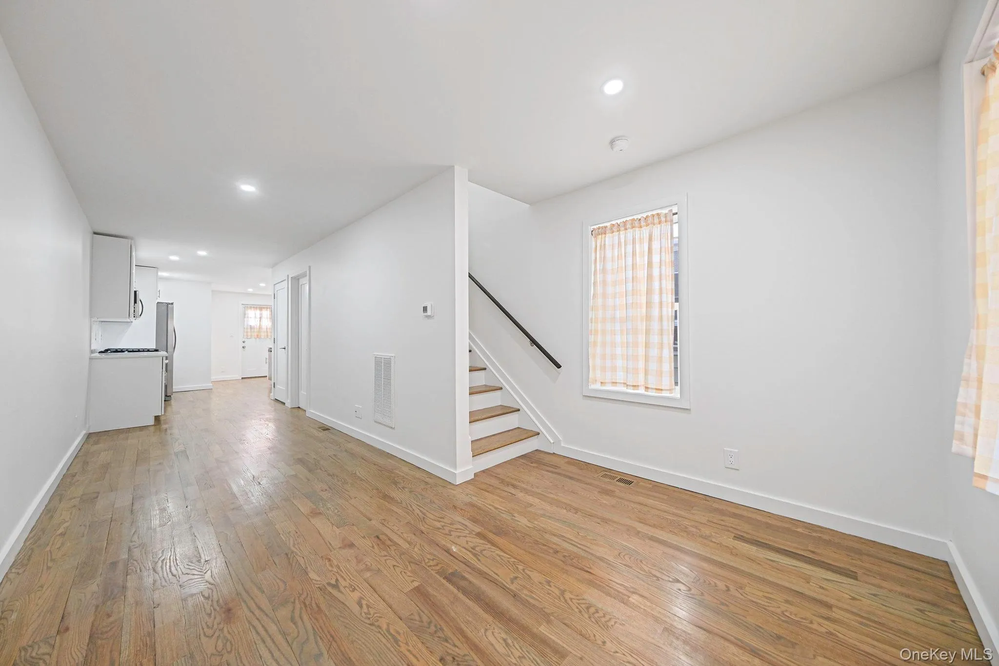 View from front door which opens up to a beautifully renovated space. View from front door which opens up to a beautifully renovated space.