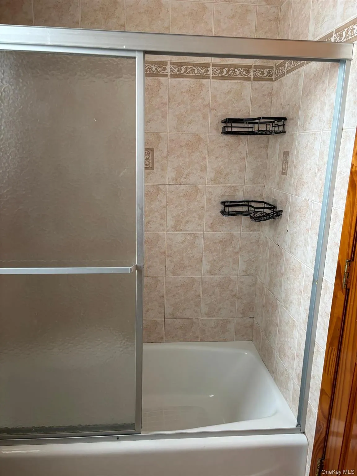 Full bath with shower / bath combination with glass door Full bath with shower / bath combination with glass door