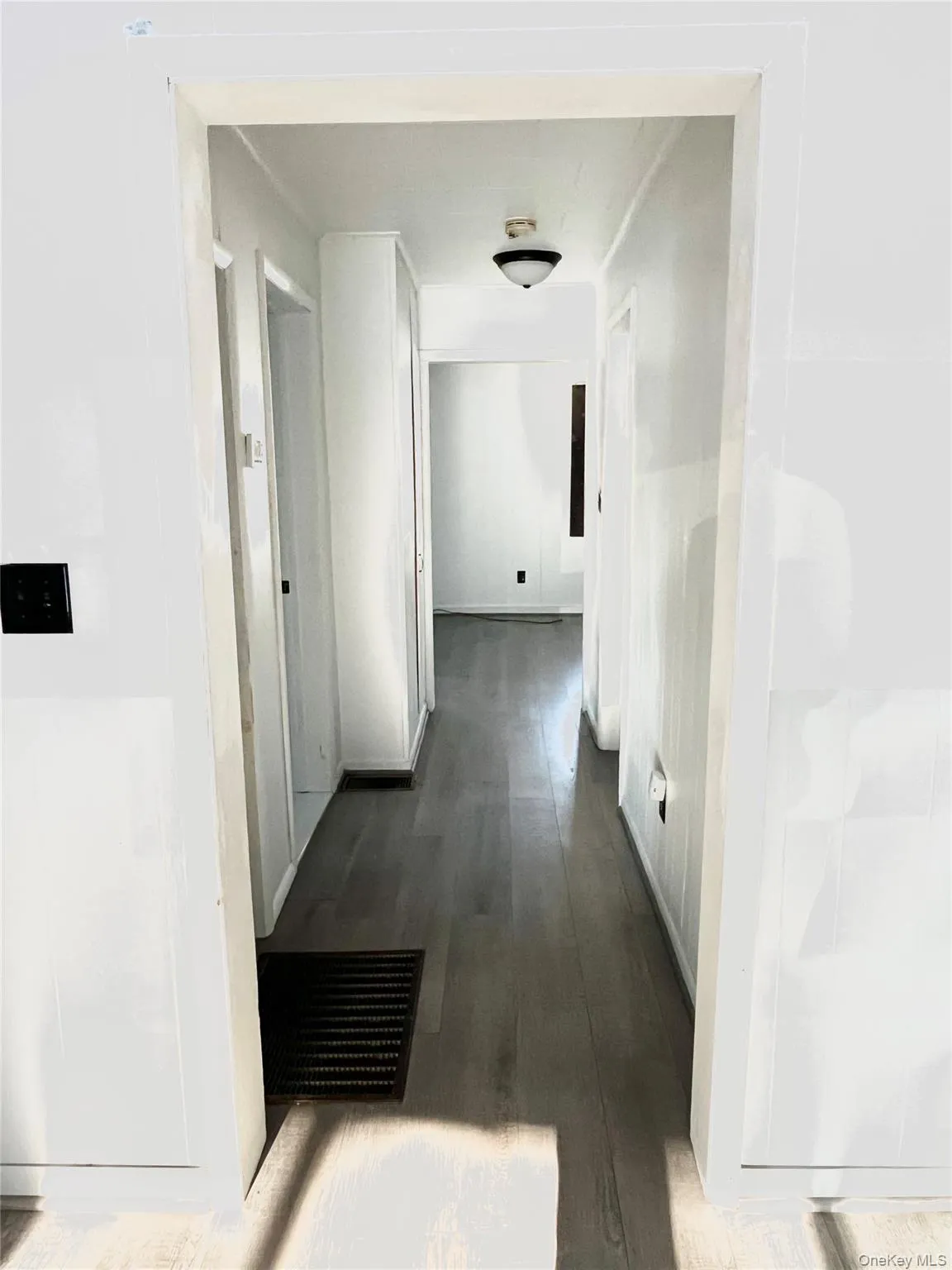 Corridor with dark wood-style floors Corridor with dark wood-style floors