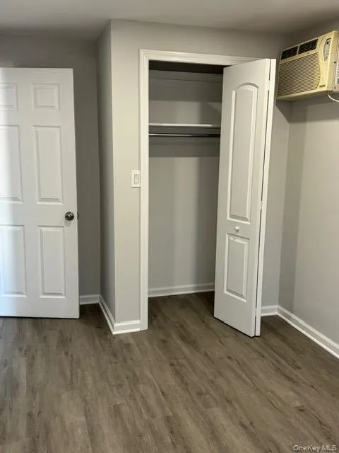 2nd bedroom with Closet and a wall mounted air conditioner 2nd bedroom with Closet and a wall mounted air conditioner