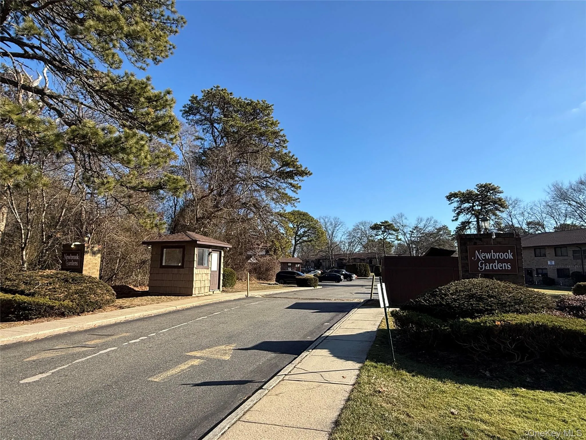 View of asphalt road featuring sidewalks and curbs View of asphalt road featuring sidewalks and curbs