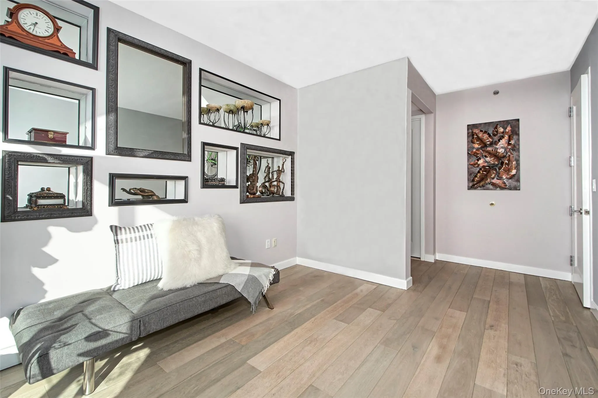 Bedroom with light wood finished floors and baseboards. Has adjoining full bathroom. Bedroom with light wood finished floors and baseboards. Has adjoining full bathroom.