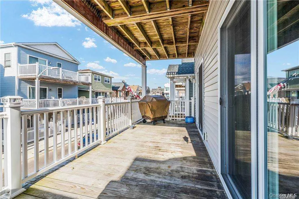 Wooden terrace with a grill Wooden terrace with a grill