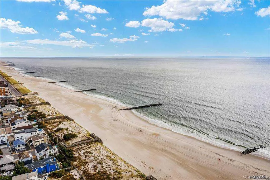 Water view featuring nearby beach Water view featuring nearby beach