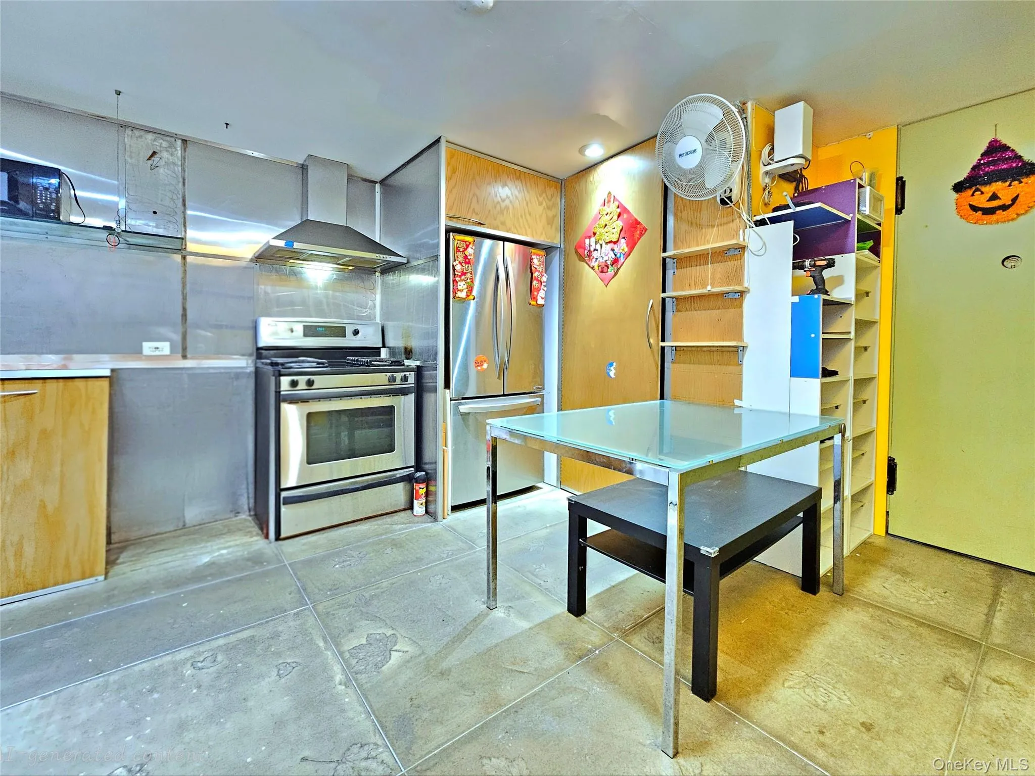 Kitchen with stainless steel appliances, wall chimney range hood, and modern cabinets Kitchen with stainless steel appliances, wall chimney range hood, and modern cabinets